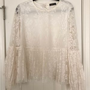 Off white floral lace top with bell sleeve.